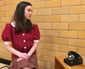 Sally Jones (played by Elta Goldstein) is hoping for a phone call.  In January of 1938, less than half of the homes in Greenbelt had telephones.  The musical is part of the Greenbelt Legacy 80th Anniversary celebration.