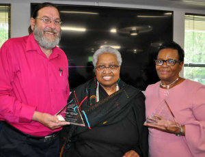 O.F. Makarah (center), Executive Director of The Heritage Film Festival, presents George Kochell (left)of Greenbelt and Ethel Lewis (right) of the Prince George's Arts and Humanities Council, awards for their cultural work supporting art organizations, artists, and youth in Prince George's county for over 20 years. The 13th Annual Heritage Film Festival took place in Greenbelt this past weekend (May 17, 19, 20) screening high quality films at the Greenbelt Library and The Greenbelt Theatre.  It is a community based, volunteer driven, free event that brings together short films of all genres from novice and seasoned filmmakers, to celebrate independent media.  Photo by Jimi Lyons
